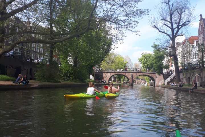 a group of people in a boat on a river