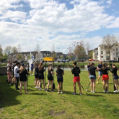 a group of people standing in a field
