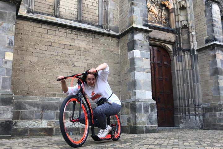 a stone building that has a bicycle in front of a brick wall