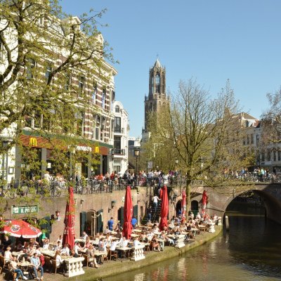 a group of people on a bridge over a river
