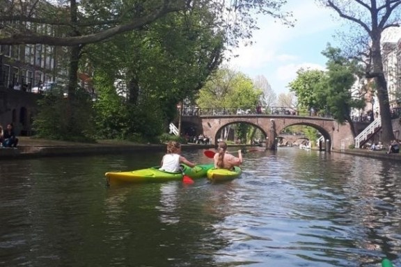 a group of people on a boat in the water